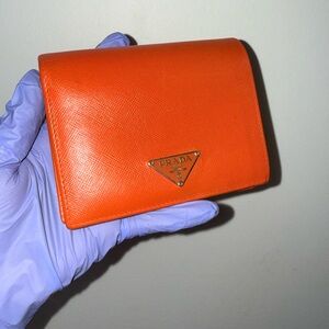 Prada Orange Saffiano Compact Wallet with Gold Triangle Logo